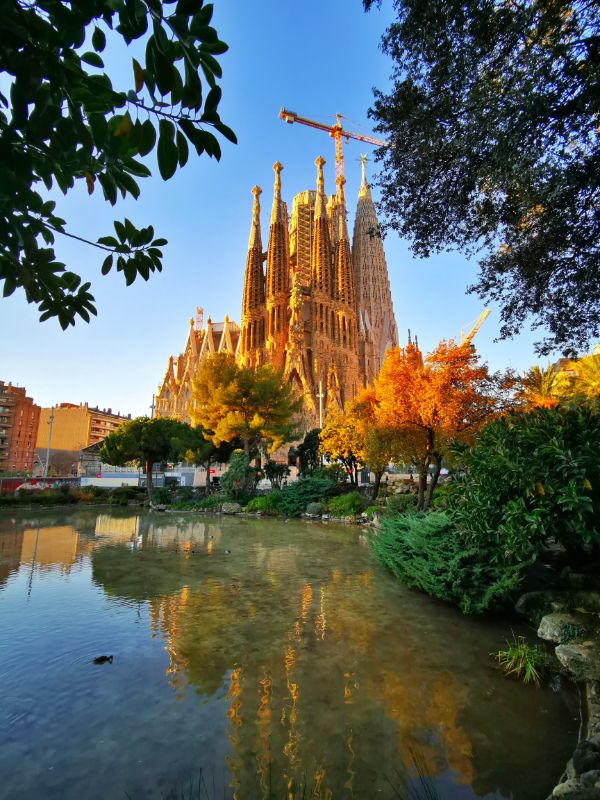 La Sagrada Familia in Barcelona from across the pond in Placa de Gaudi 
