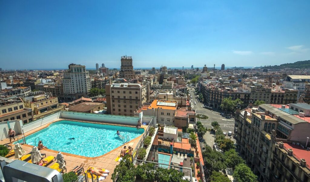 A Hotel in Barcelona with a rooftop pool and view of the city