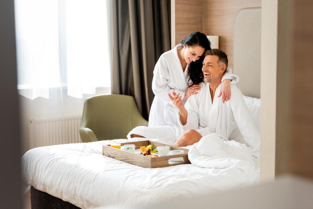 Couple in a Hotel Room enjoying Breakfast in Bed - Romantic Hotels in Barcelona