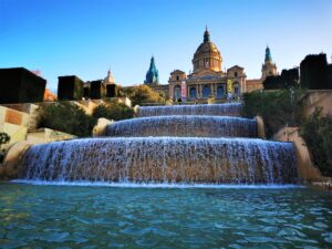 The MNAC Art Musum at Montjuic with Fountains Cascading in Front of the Castle-Like building - Why Visit Barcelona in May